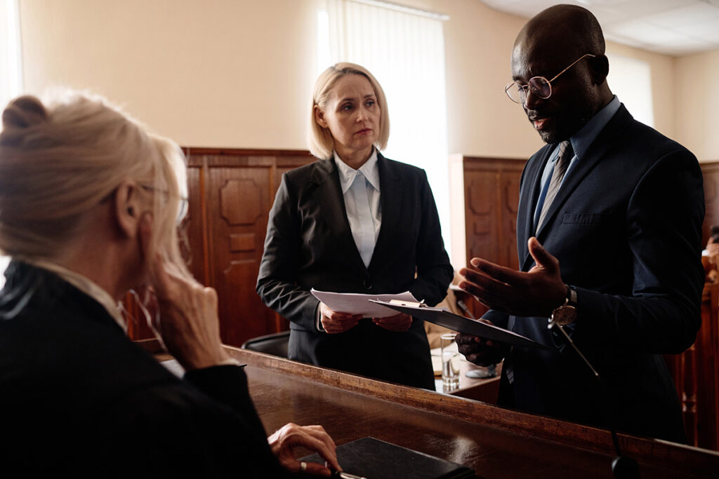 Attorneys Reviewing Appeal Bond Documentation in Courtroom